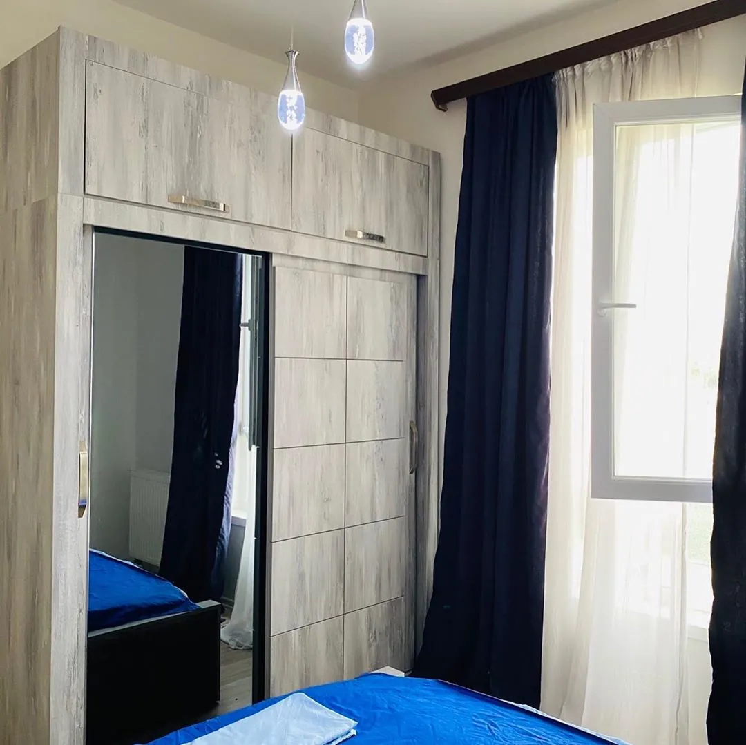 Bedroom wardrobe beside a window